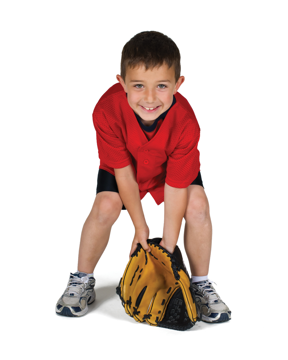 Young boy fielding a ground ball.