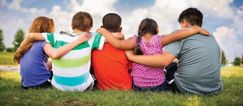 Children hugging each other.