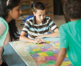 children reading map