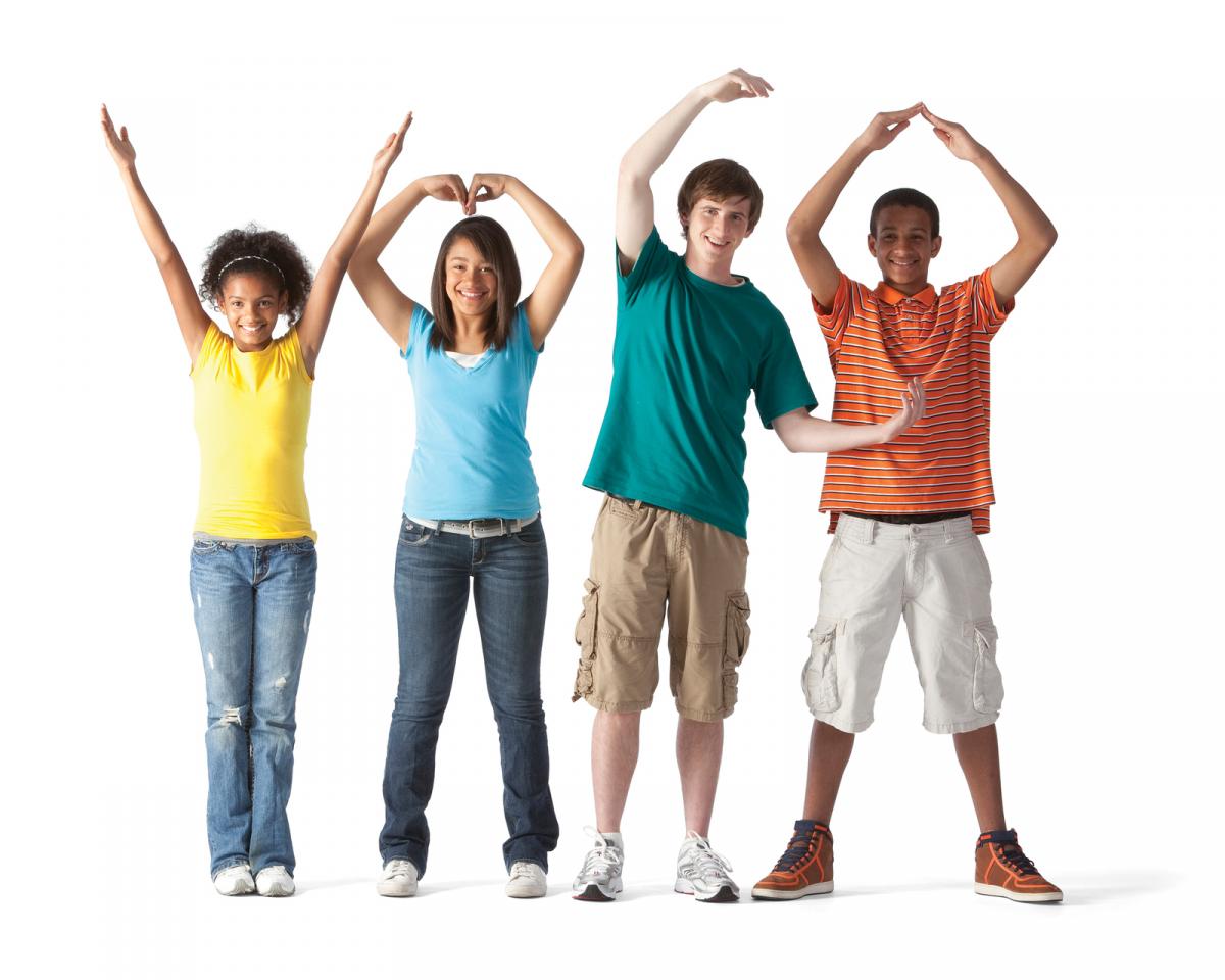 Teenagers forming "YMCA."