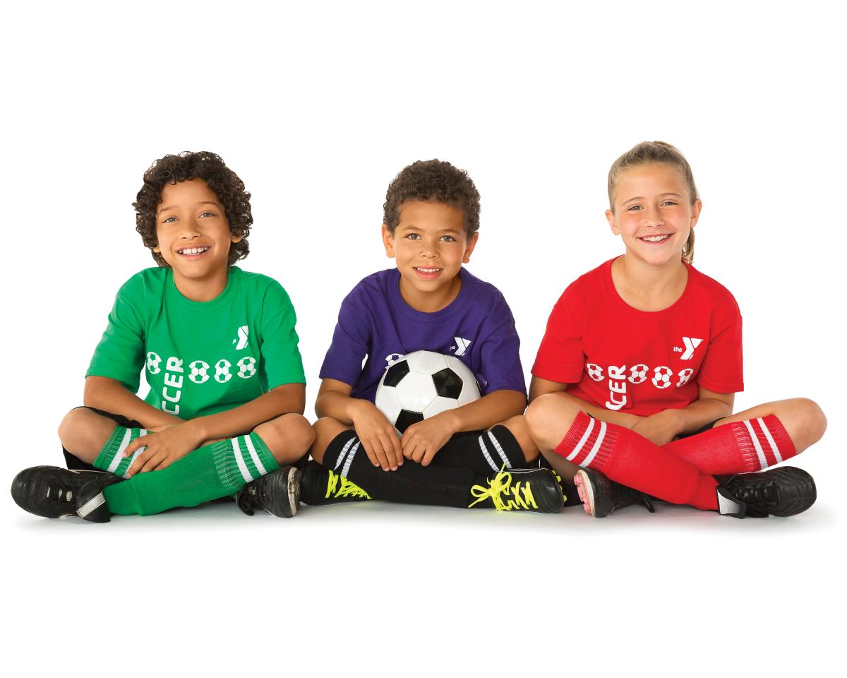 Three children sitting on ground with soccer ball. 